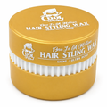 Yellow container of hair styling wax with white text and applicators on a white background