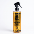Bottle of cologne labeled 'One Million Dollars' with a spray nozzle on a white background