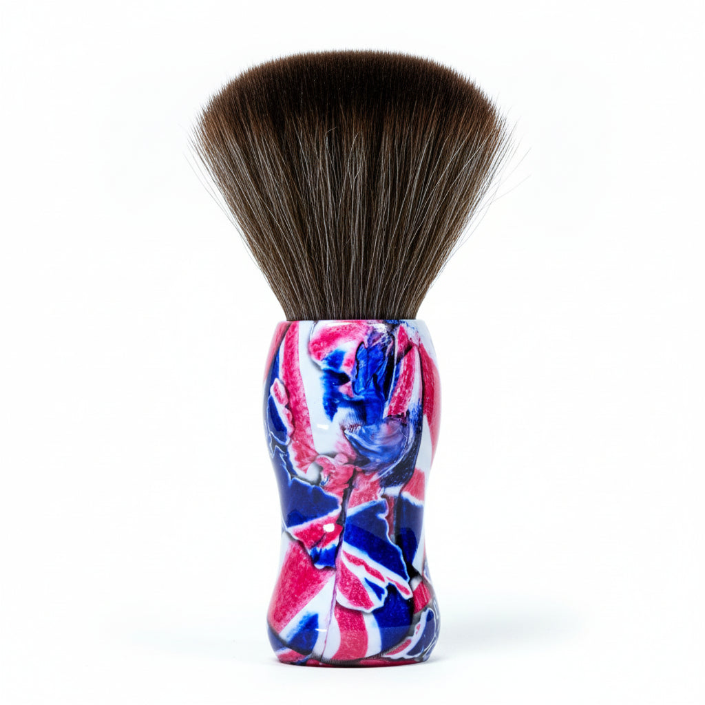 Shaving brush with a Union Jack handle on a cardboard background