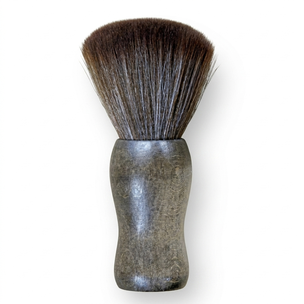 Shaving brush with black bristles on a white background