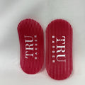 Two red hair gripers with 'TRU BARBER' text on them placed on a white background.