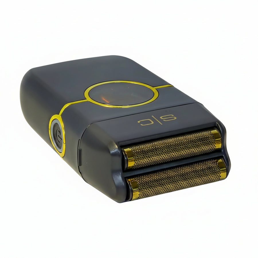 Black and gold electric shaver on a white surface