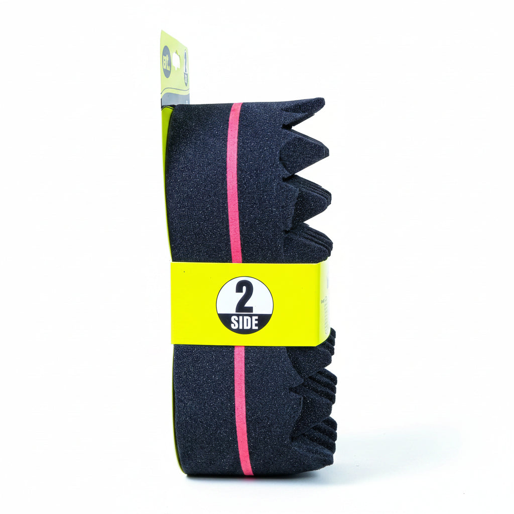 Navy blue neck strip with yellow and pink accents on a cardboard background